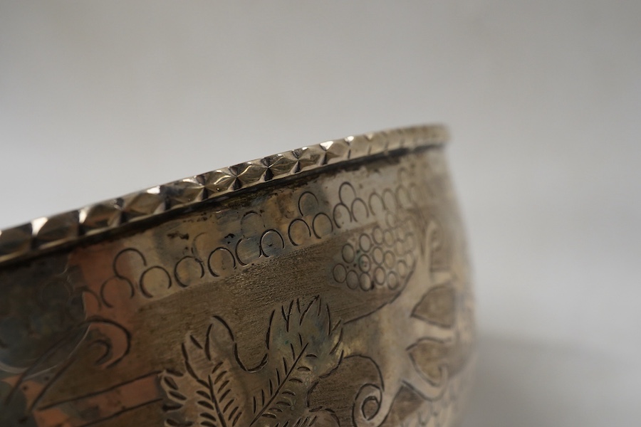 A continental circular white metal bowl with engraved fruiting vine decoration, diameter 19.8cm, 14oz.